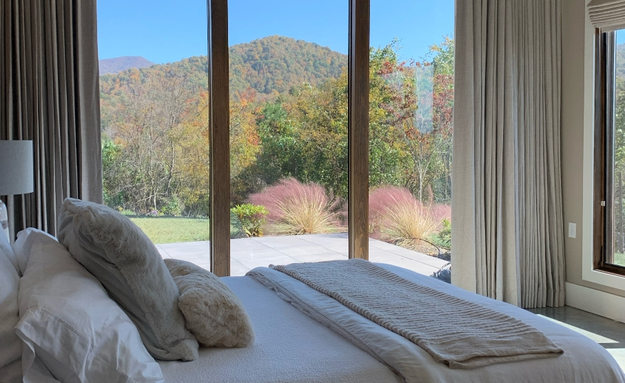 White bed, window with the hill view