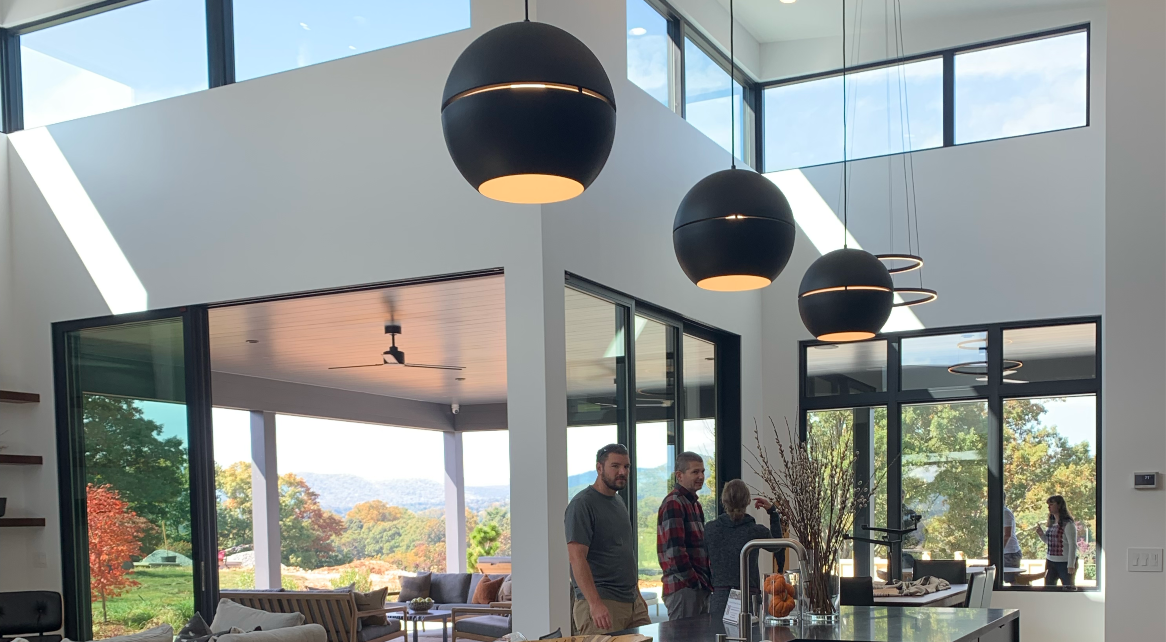 People standing and looking towards camera in the sitting room