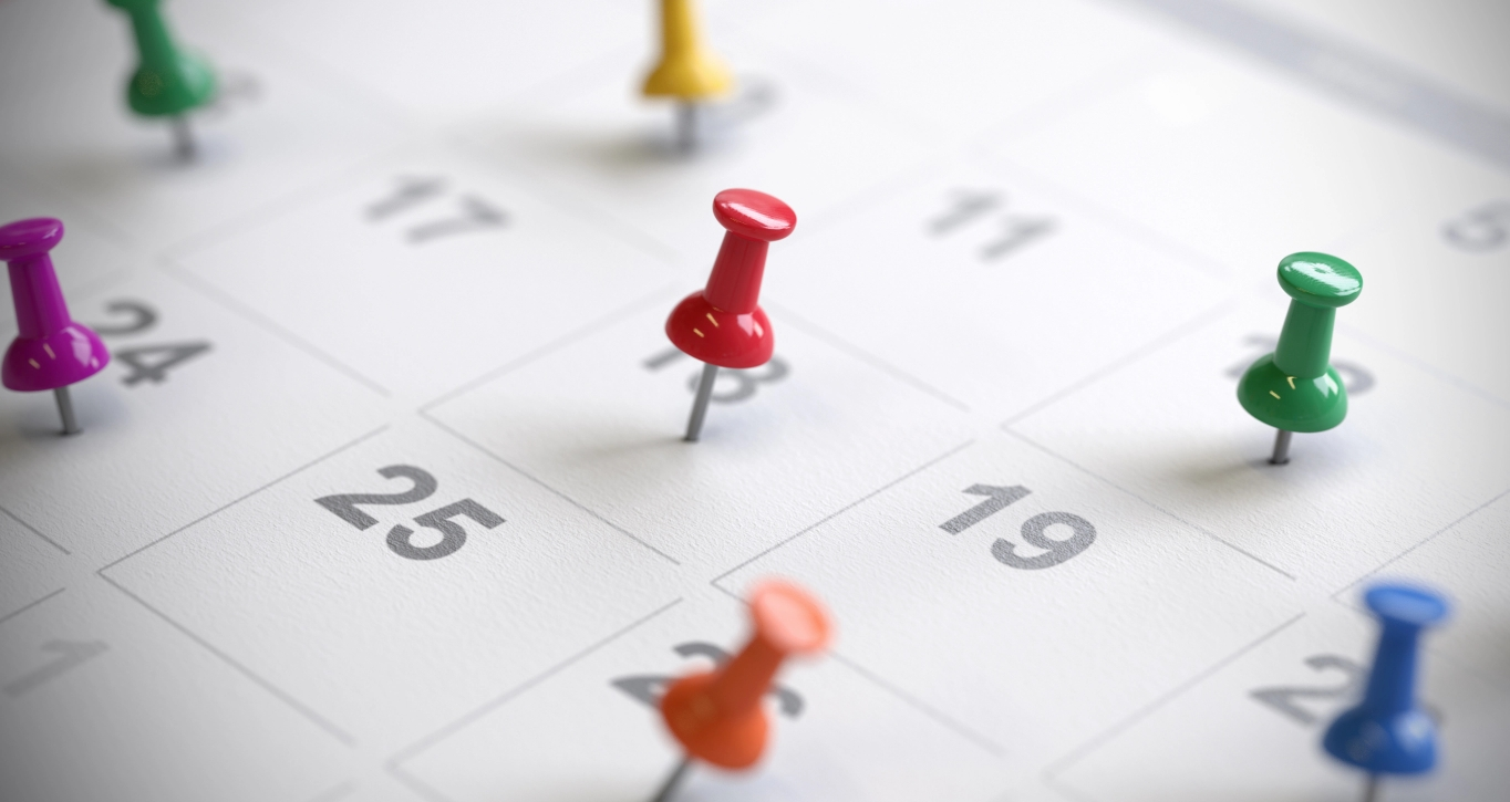 Calendar dates marked with colourful pins