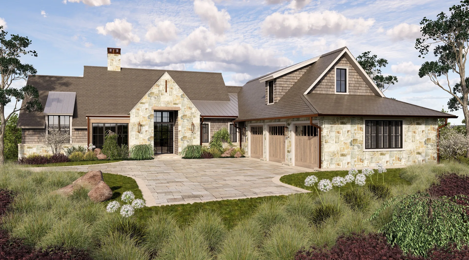 Stone and shingle home with gabled roof and landscaped front yard.