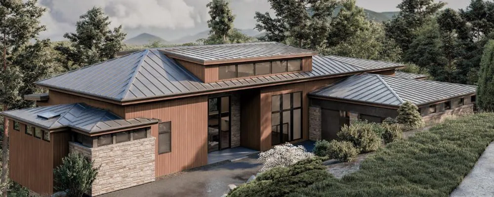Modern mountain home with metal roof and wood siding surrounded by trees.
