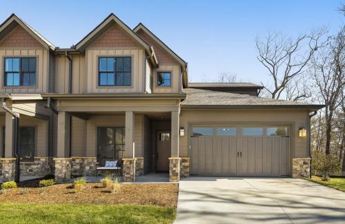 Chimney Crossing at Champion Hills tan exterior with garage.