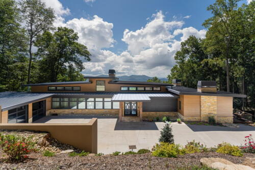 Exterior modern home with stunning view of the mountains.