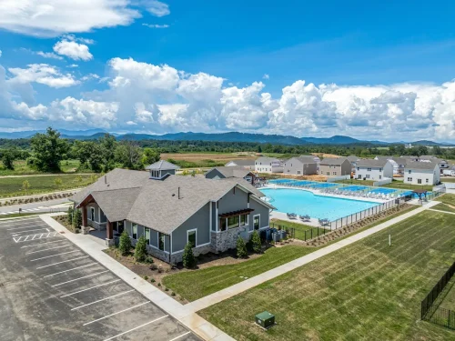 Aerial view of Tap Root Farms clubhouse, pool, and mountain backdrop