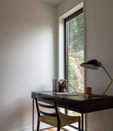 Haith corner section of room with desk and window