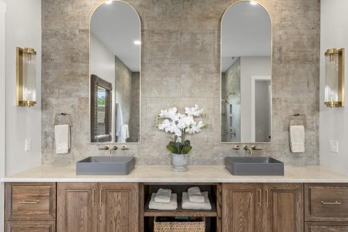 Benton Farms bath with double sinks and mirrors.