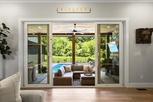 Benton Farms sliding glass door looking onto back porch and pool.