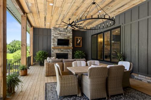 Benton Farms back porch with fireplace and seating.