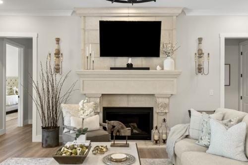 Benton Farms living room with white fireplace.