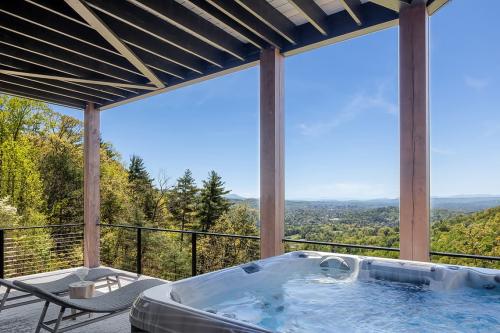 Art House back deck with hot tub with a beautiful view.