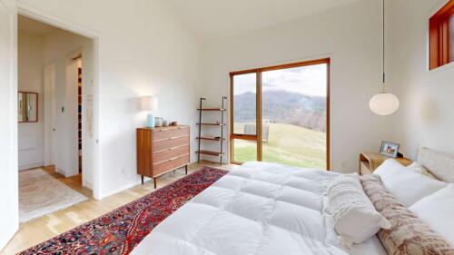Arcadian Abode bedroom with large window and lots of light.