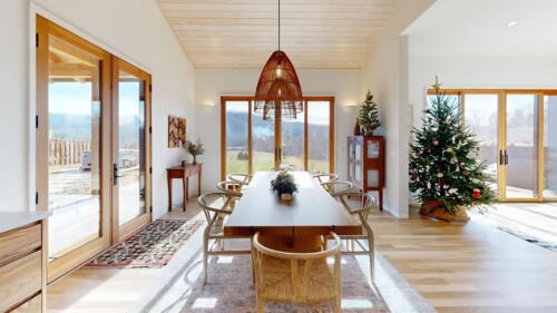 Arcadian Abode dining room filled with light and windows.