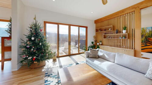 Arcadian Abode living room wooden wall with vertical slats and decorative shelves.