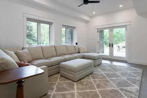 Living room with sectional sofa and French doors to patio.