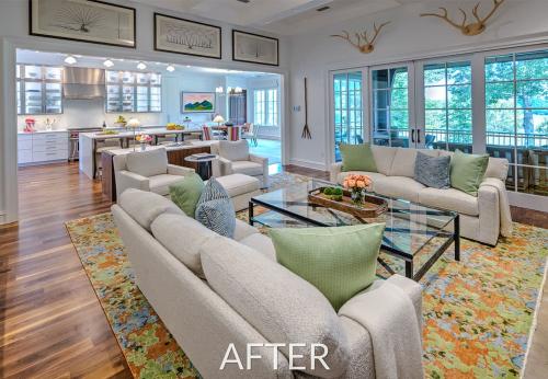 After Photo of Remodeled living space. Clean and southern style homes with lots of white and light. Kitchen blends seamlessly into the living space. 
