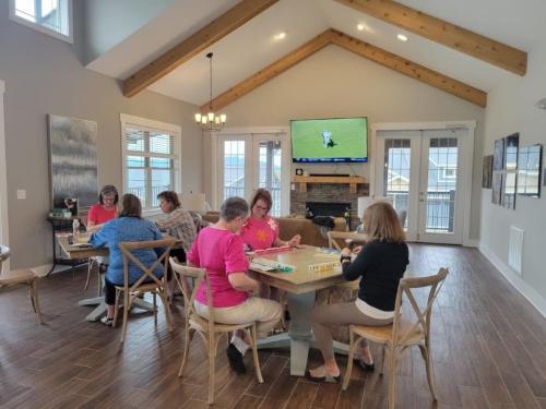 Pinnacle at Arabella room with ladies sitting around tables playing a game.