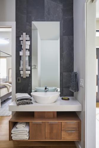 Rockcrest bathroom with white modern sink and cabinets.