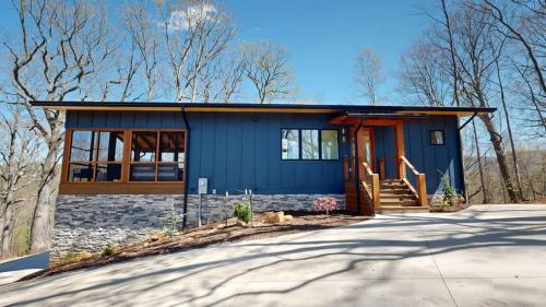 The Modern Tree House blue exterior and front entrance.