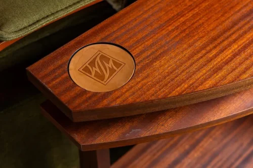 Close-up of a custom wood table featuring an inset decorative emblem.