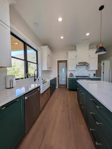 Custom Barndominium kitchen with dark and white cabinets.