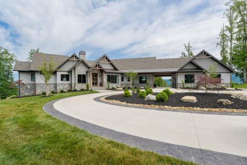 Rustic Mountain Estate exterior front with wrap around driveway.